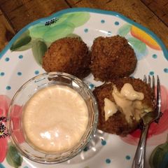A picture of Mac & Cheese Balls with Buffalo Ranch Dipping Sauce.