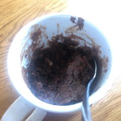 A picture of Gooey brownie in a mug.