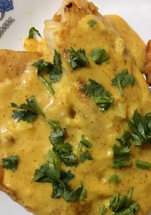 A picture of Tilapia in coconut sauce.