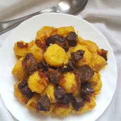 A picture of Peanut Butter Matoke With Fried Liver.