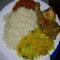 A picture of White rice with cabbage and chicken.