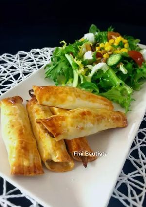Una foto de Rollos de obleas rellenos de setas y puerros