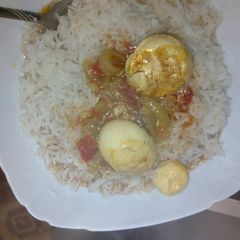 Egg curry and rice A picture of Egg curry and rice.
