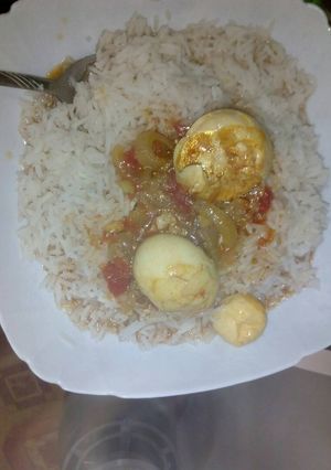 A picture of Egg curry and rice.