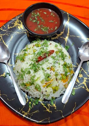 A picture of Rice Pulao with Tomato soup.