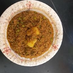 A picture of Mince keema with peas and potato.
