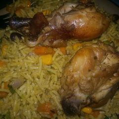 A picture of Fried Rice and Chicken.