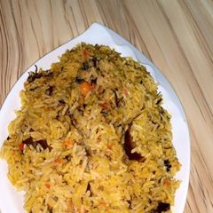 A picture of Jollouf rice with dry fish.