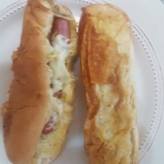 A picture of Hot dog and peppermint tea.