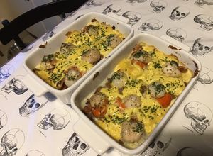 Une photo de Noix de saint Jacques fraîches gratinées aux girolles sauce curry