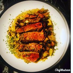 A picture of Ranch Steak with Roast Mix Potatoes, Red Onions and Peppercorn Sauce.