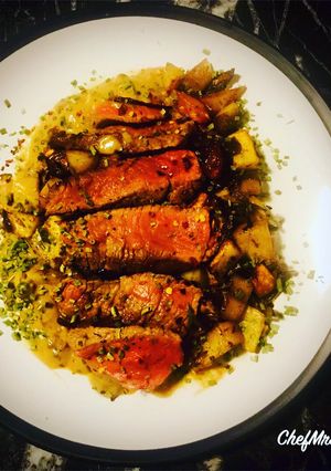 A picture of Ranch Steak with Roast Mix Potatoes, Red Onions and Peppercorn Sauce.