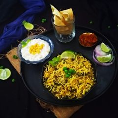 A picture of Methi Matar Pulao and Boondi Raita.
