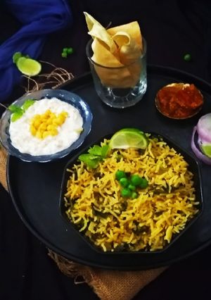 A picture of Methi Matar Pulao and Boondi Raita.