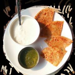 Aaloo pyaaz paratha with curd and garlic chutney A picture of Aaloo pyaaz paratha with curd and garlic chutney.