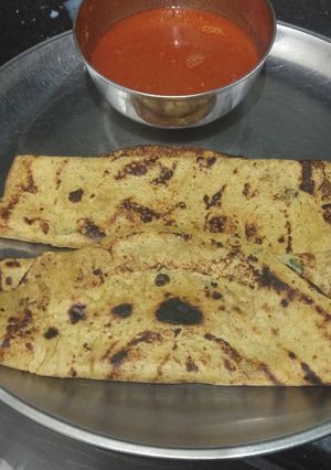 A picture of Besan chilla with tomato gravy.