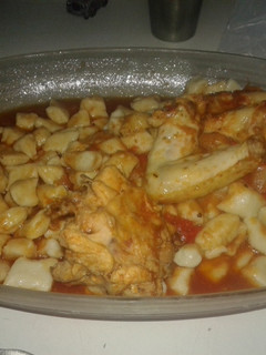 Una foto de Ñoquis de papa con salsa de pollo