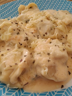 Una foto de Ravioli de ricotta y espinacas con salsa de calabaza