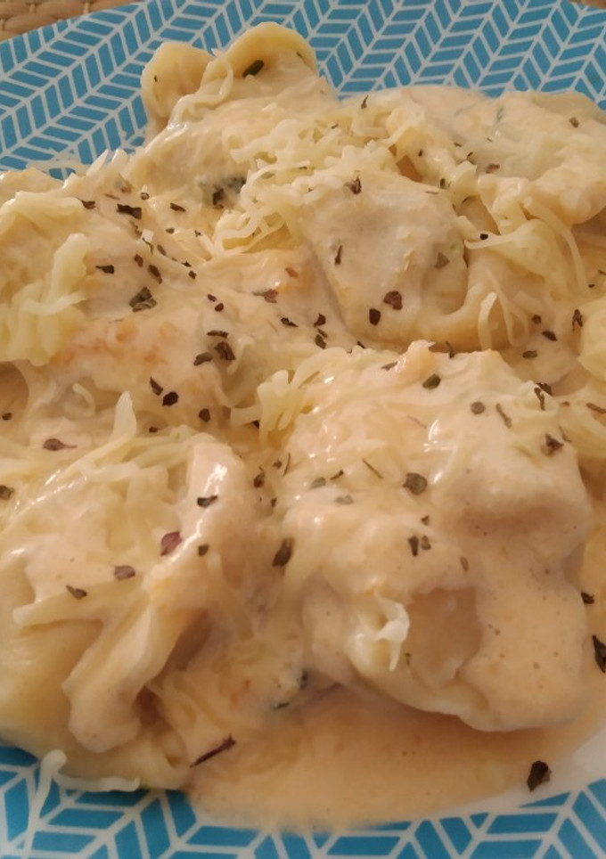 Una foto de Ravioli de ricotta y espinacas con salsa de calabaza