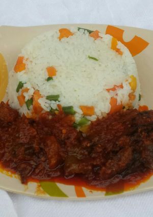 A picture of Veggie rice with dryfish stew.