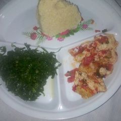 Fried eggs/kales and ugali A picture of Fried eggs/kales and ugali.
