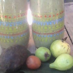 A picture of 3 avocados and guava smoothie.