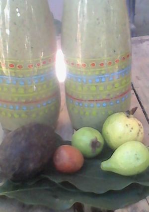 A picture of 3 avocados and guava smoothie.