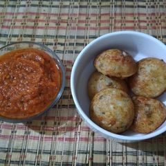 A picture of Vegetable Appe with Tomato Chutney.