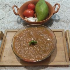 A picture of Raw mango tomato and garlic chutney.