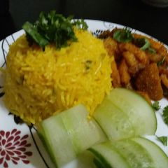 A picture of Burnt garlic rice with fried potatoes.