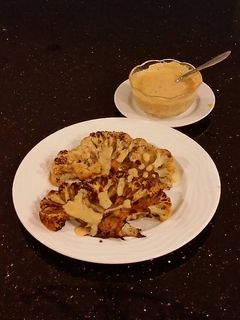 A picture of Spicy Grilled Cauliflower with Sriracha Hollindaise Sauce.