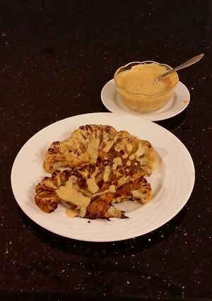 A picture of Spicy Grilled Cauliflower with Sriracha Hollindaise Sauce.
