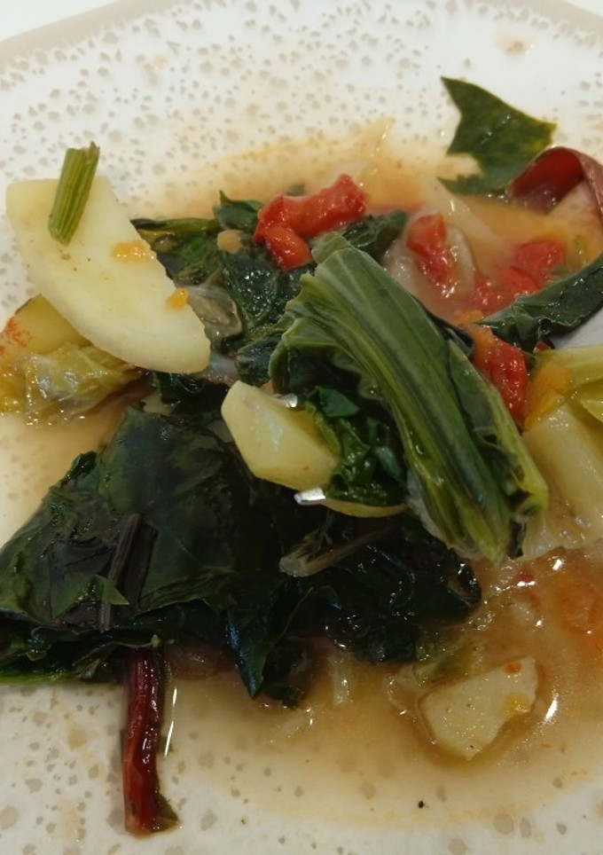 Una foto de Verduras de hoja pochadas