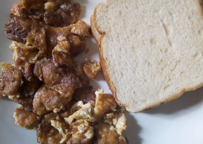 Fried eggs and bread for breakfast