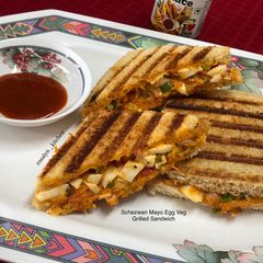 A picture of Schezwan Mayo Egg Veg Grilled Sandwich.