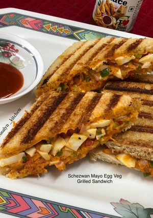A picture of Schezwan Mayo Egg Veg Grilled Sandwich.