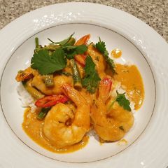 A picture of Prawns with penang or red curry with rice.