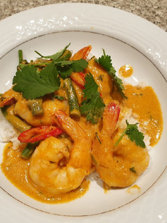 A picture of Prawns with penang or red curry with rice.