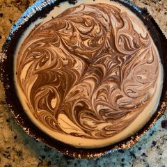 A picture of Cheesecake with Chocolate Fudge Swirl.