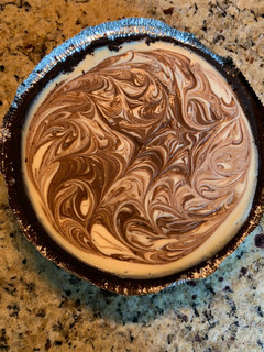 A picture of Cheesecake with Chocolate Fudge Swirl.