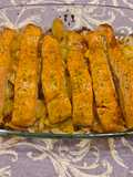Lomos de salmón al horno con salsa miel y mostaza y cama de patatas