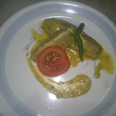 A picture of Sorse potol(parwal cooked in mustard seeds).