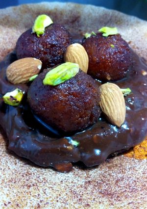 A picture of Chocolate instant browinee topped with gulab jamun.