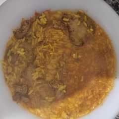 Una foto de Arroz con asaduras de pollo