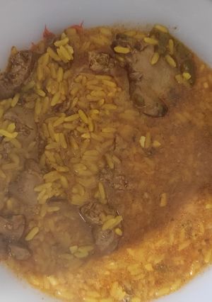 Una foto de Arroz con asaduras de pollo