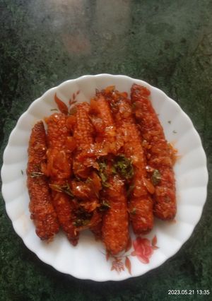 A picture of Baby corn schezwan dry.