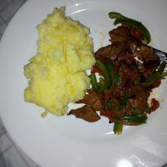 A picture of Cheesy mashed potatoes and beef.