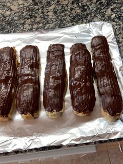 Una foto de Cañas rellenas de crema de naranja con canela