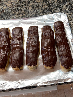 Una foto de Cañas rellenas de crema de naranja con canela