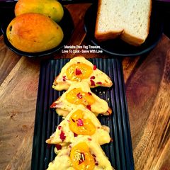 A picture of Mango Rabdi Shahi Tukda - Royal Mango Bread Pudding - Indian Summery Dessert.